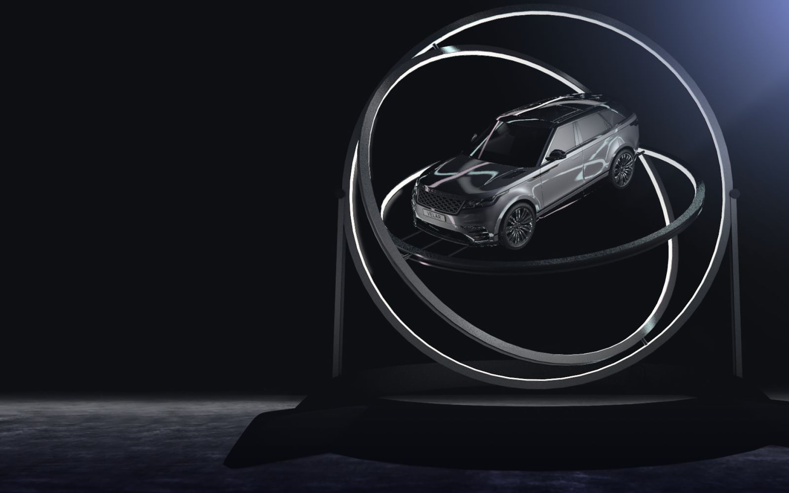 The Velar suspended inside two lit rings on a dark stage, rendered in a game engine