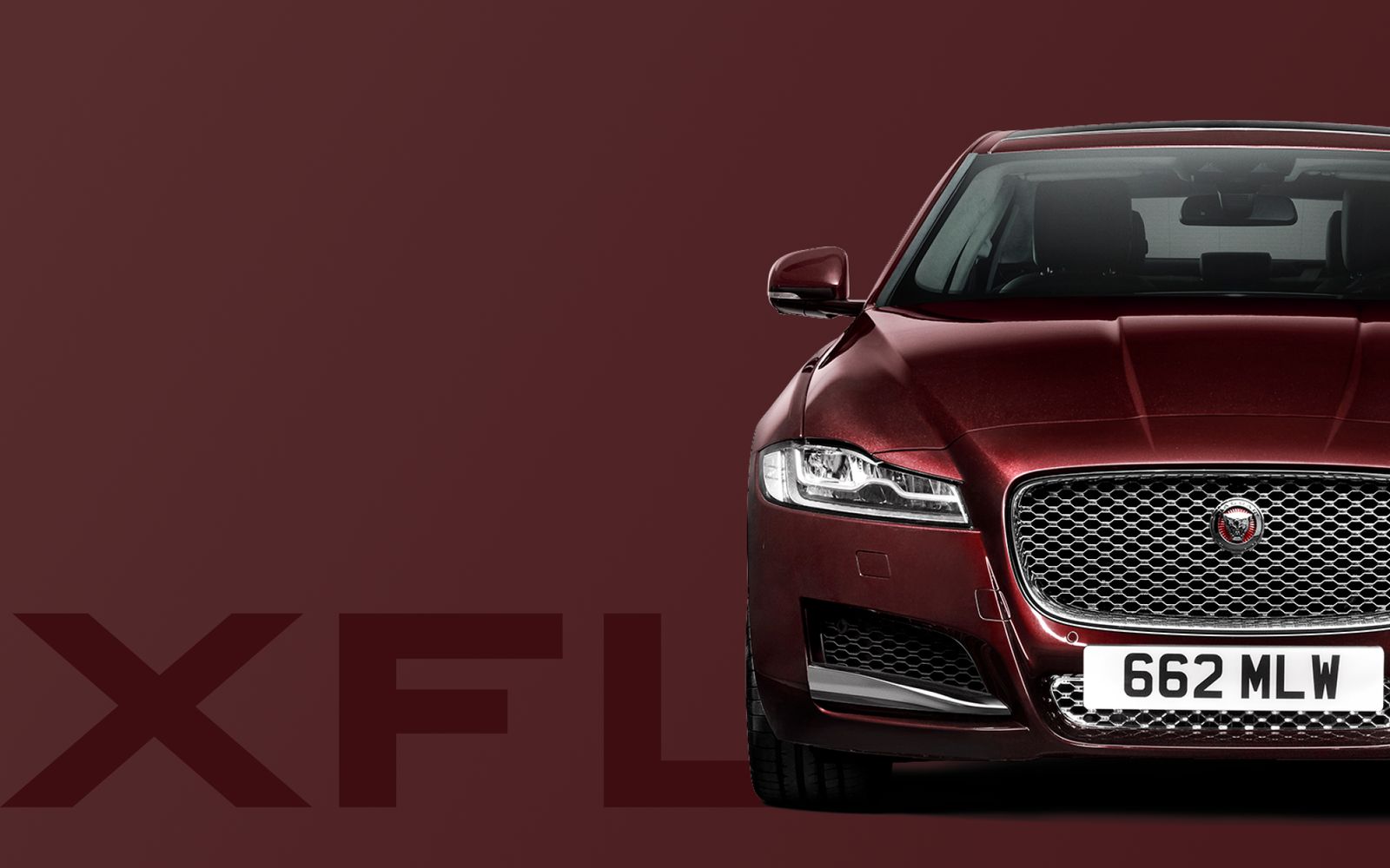 The front of the Jaguar XFL in dark red against a matching ground