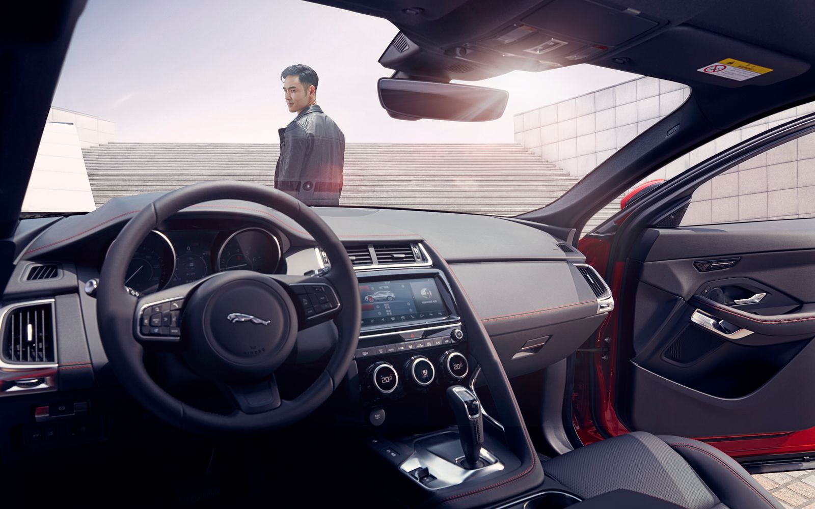 Interior photography, looking out from the driver's seat at the ambassador on a staircase